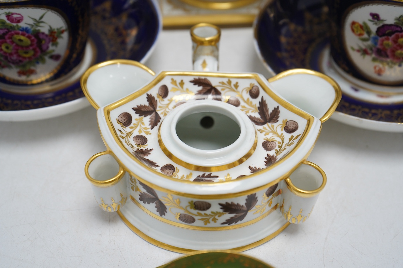 A quantity of 19th century porcelain to include Flight Barr & Barr, Worcester pedestal bowl, two Chamberlains Worcester breakfast trios and ink stand, largest 11cm high. Condition - fair, Flight Barr & Barr restored